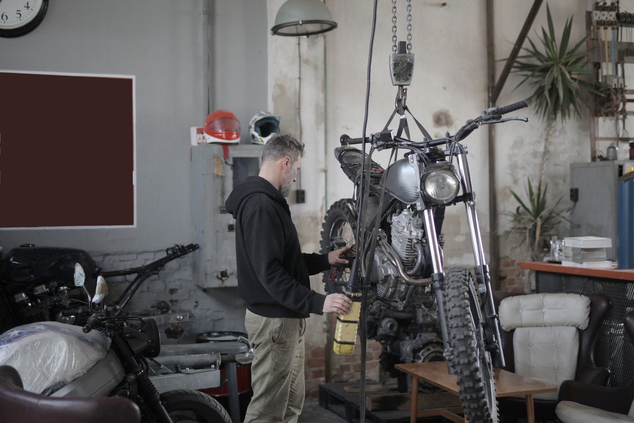 man repairing bike