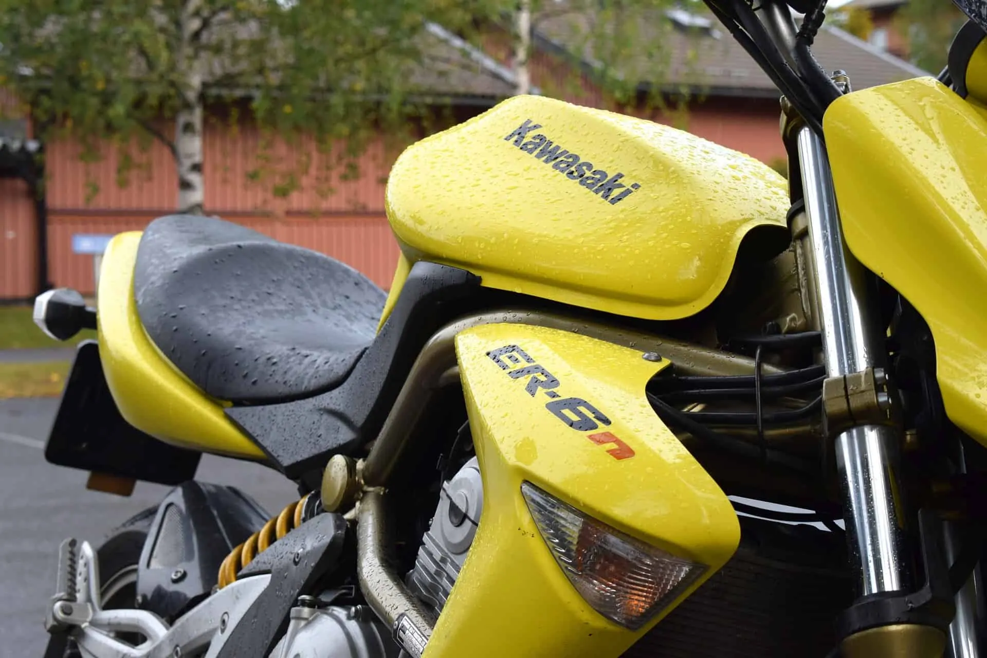 wet yellow motorcycle