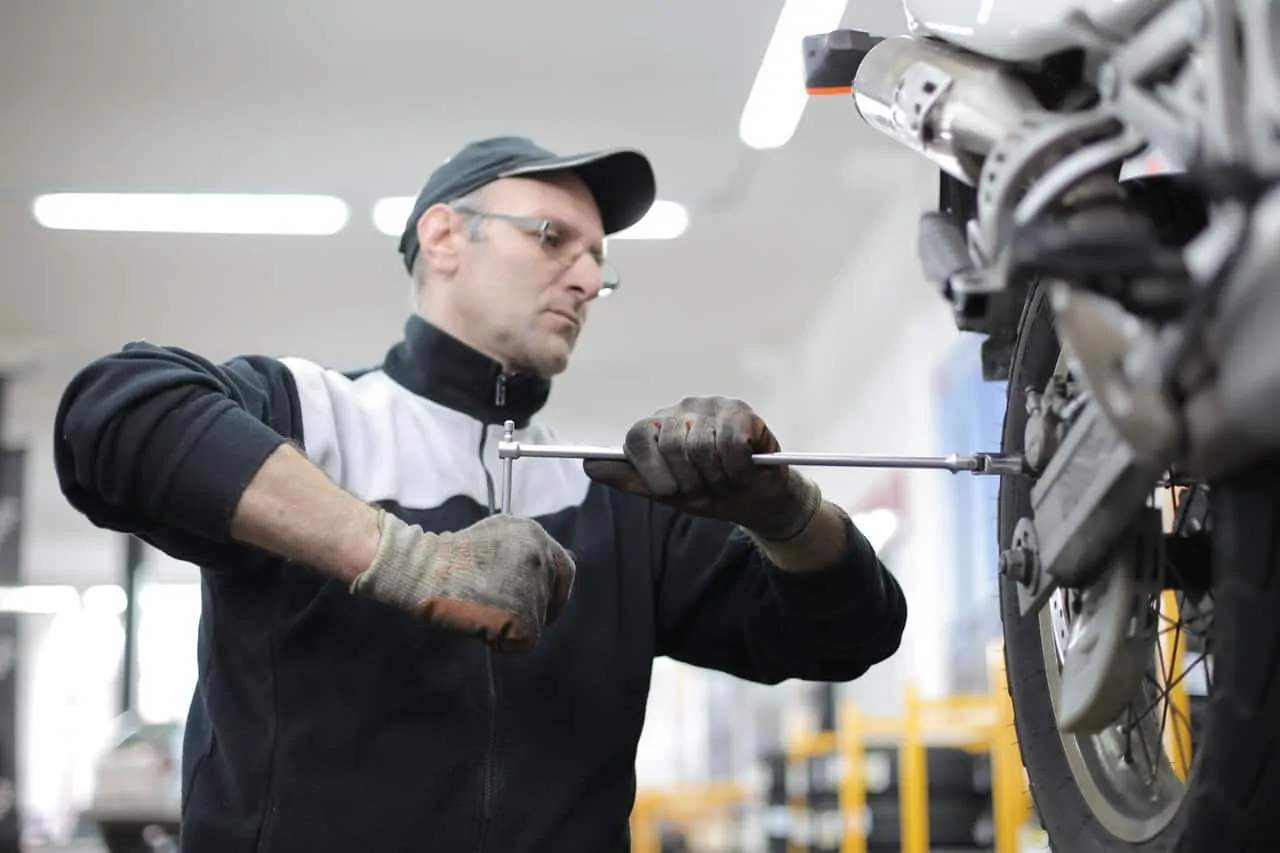 man changing tire