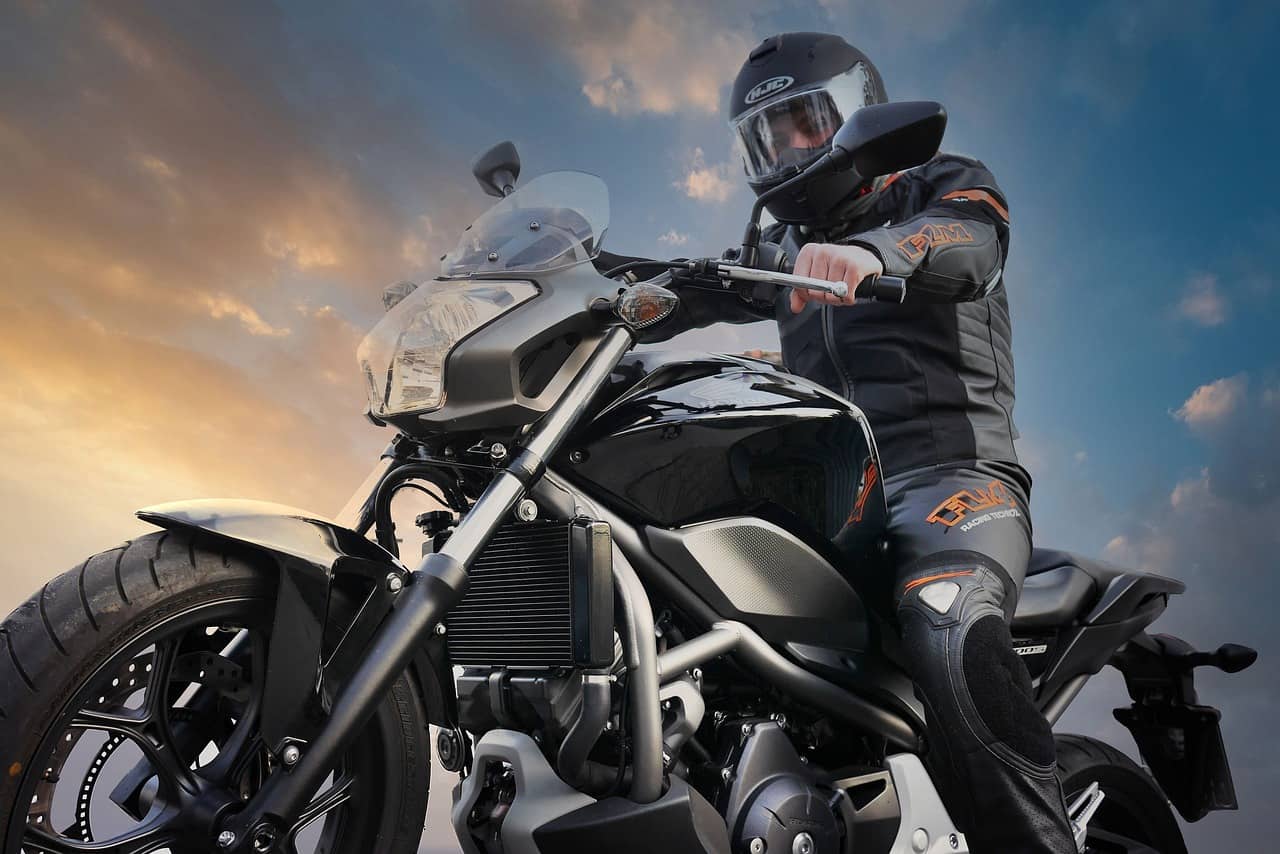 man riding motorcycle sky